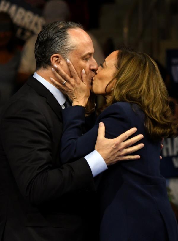 Doug Emhoff, seen here with wife Kamala Harris, has been hailed as a feminist but new accusations that he slapped an ex-girlfriend have been met with silence.