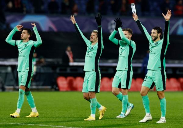 Two own goals help Atletico Madrid reach Champions League knockout stage